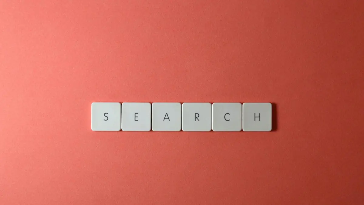 Close-Up Shot of Keys on a Red Surface