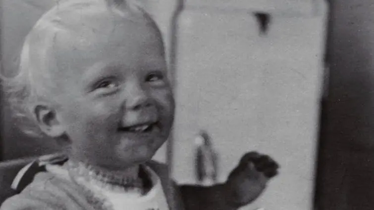 Photo of Happy Baby Sitting on High Chair Eating