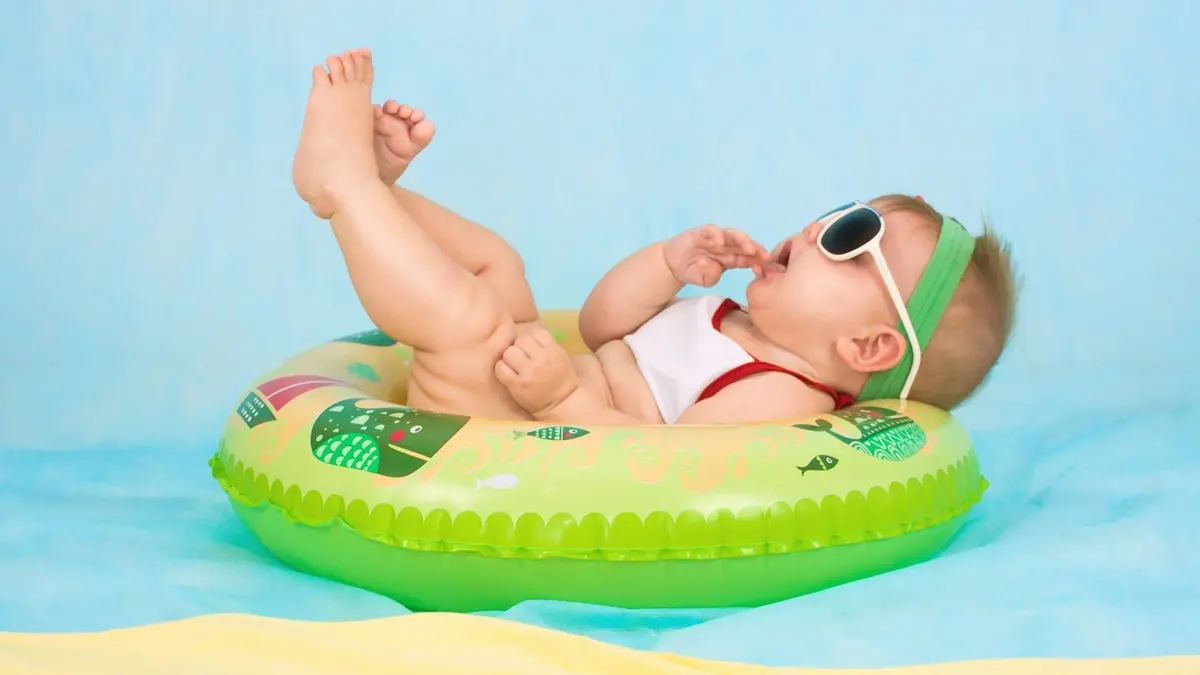 baby lying on inflatable ring