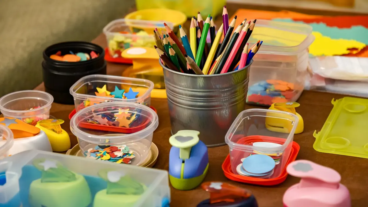 assorted color pencils in clear plastic container