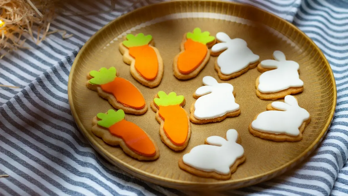a plate of decorated cookies on a table