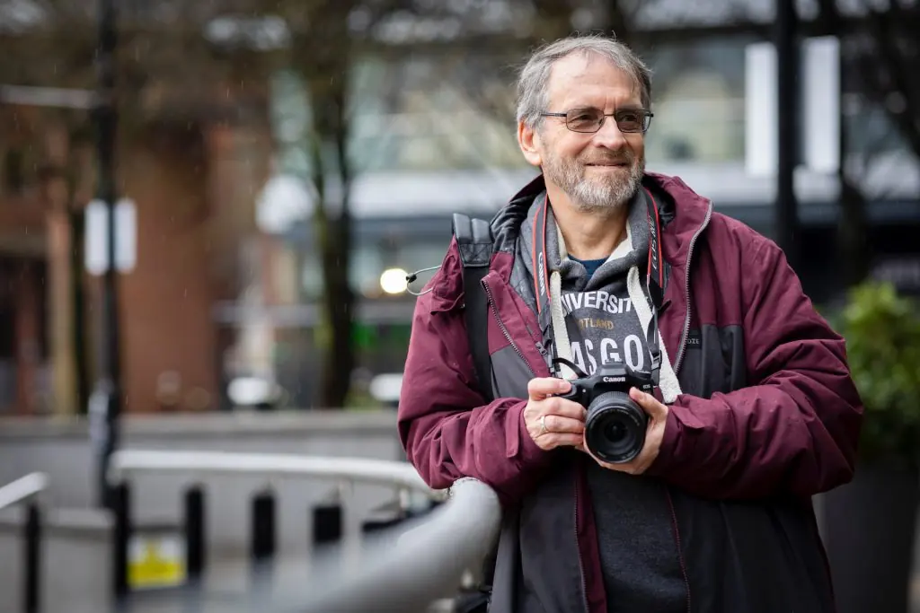 a man holding a camera in his hands