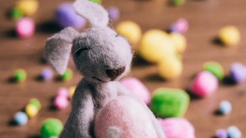 closeup photo of gray rabbit plush toy