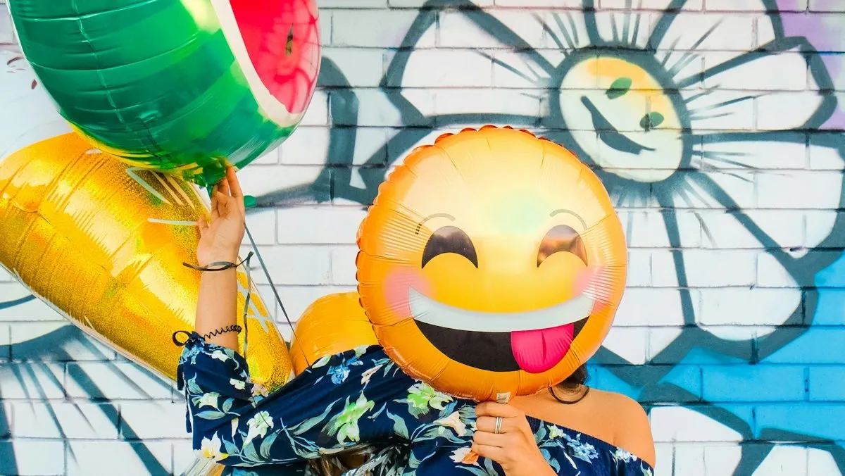woman holding balloons