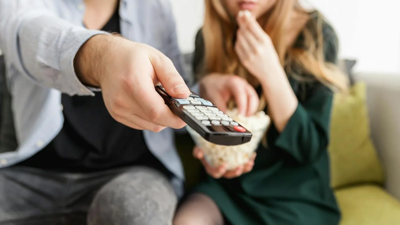 Man Holding Remote Control