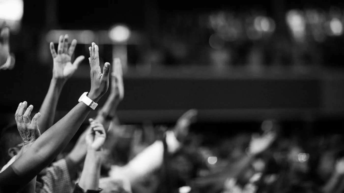 Grayscale Photography Of Hands Waving
