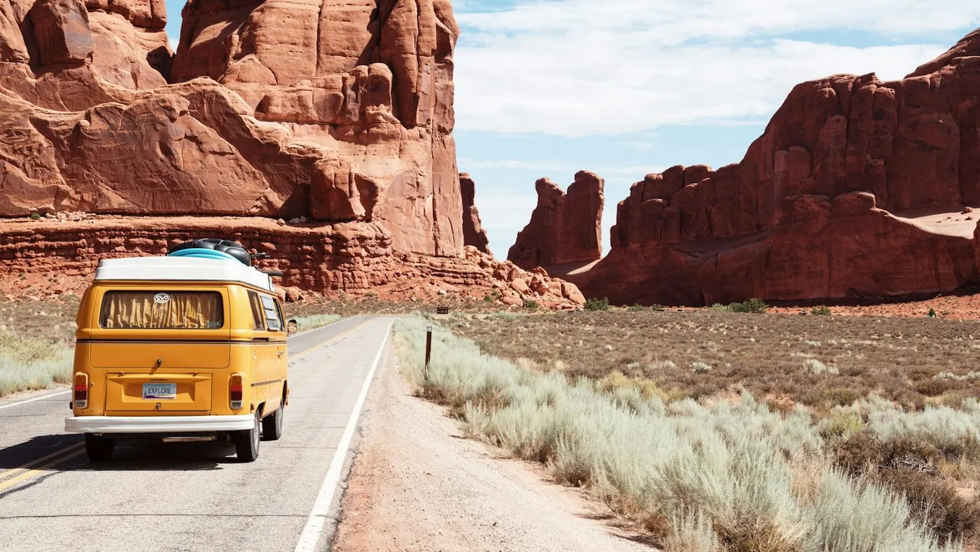yellow Volkswagen van on road
