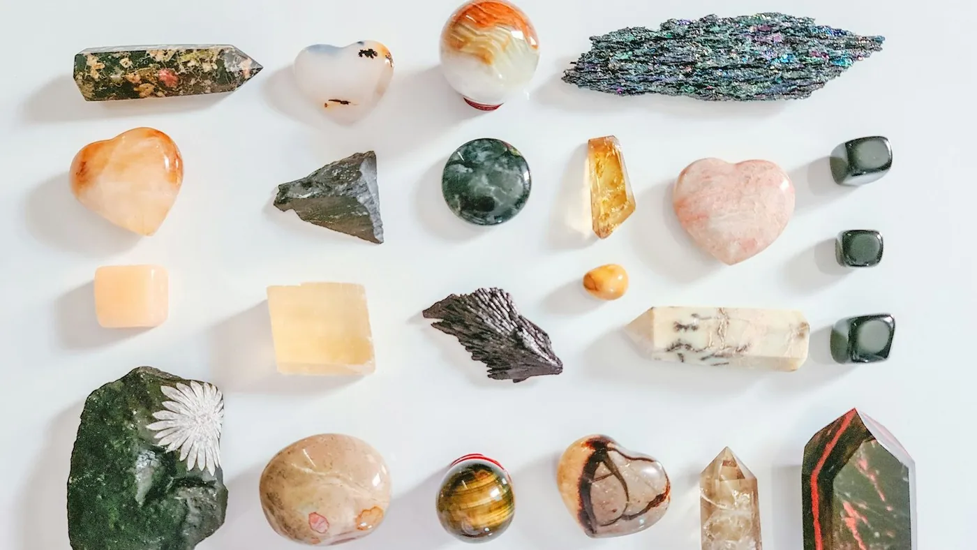 assorted color of stone on white table