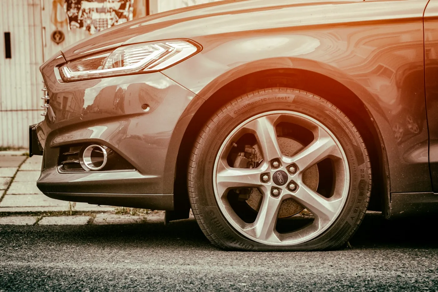 red mercedes benz c class flat tire