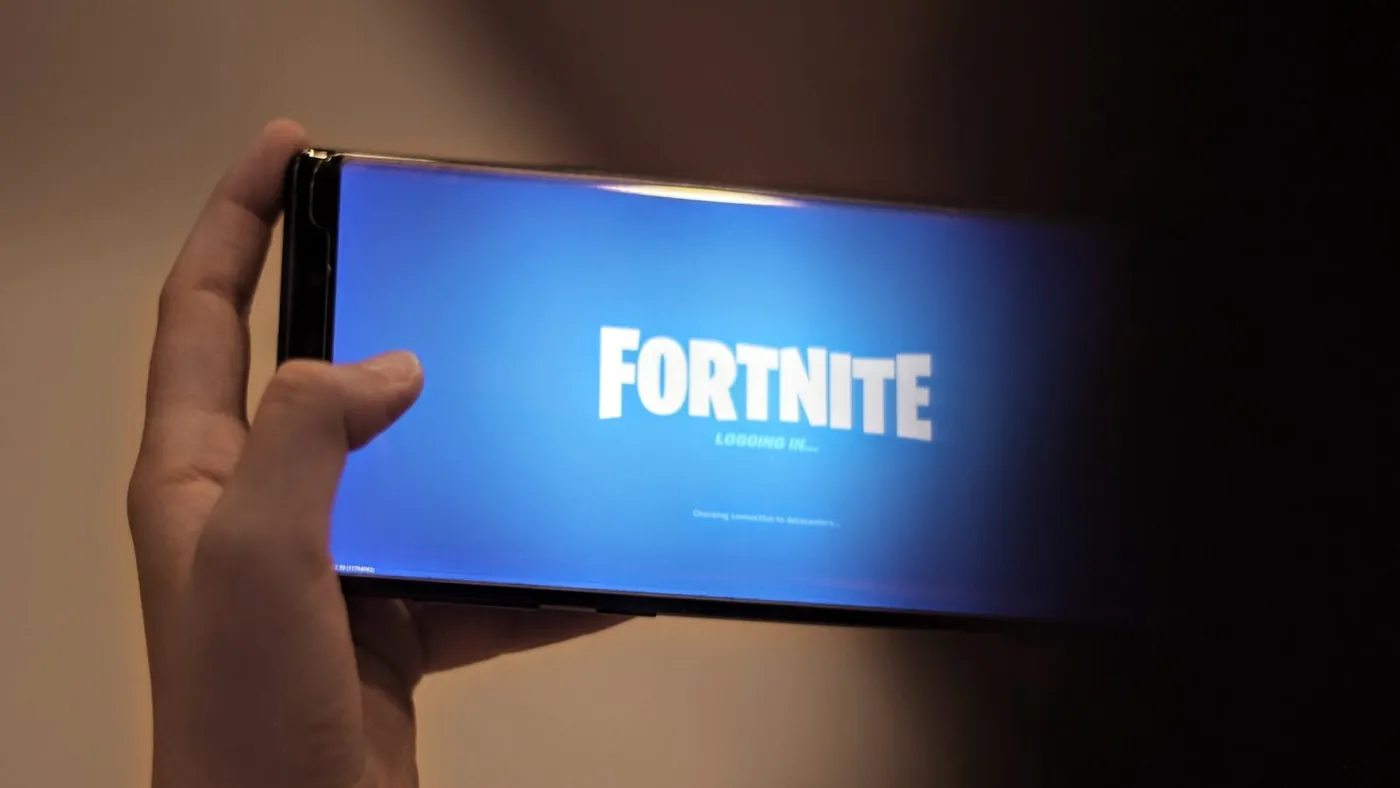 person holding blue and white box