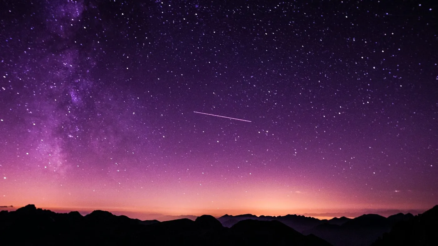silhouette photo of mountain during night time