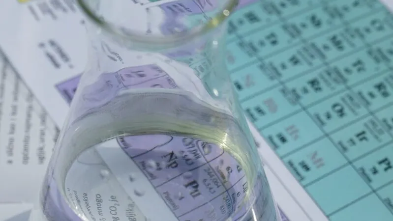clear glass pitcher on white paper