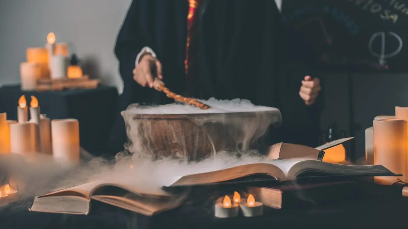 person holding wand on top of bowl