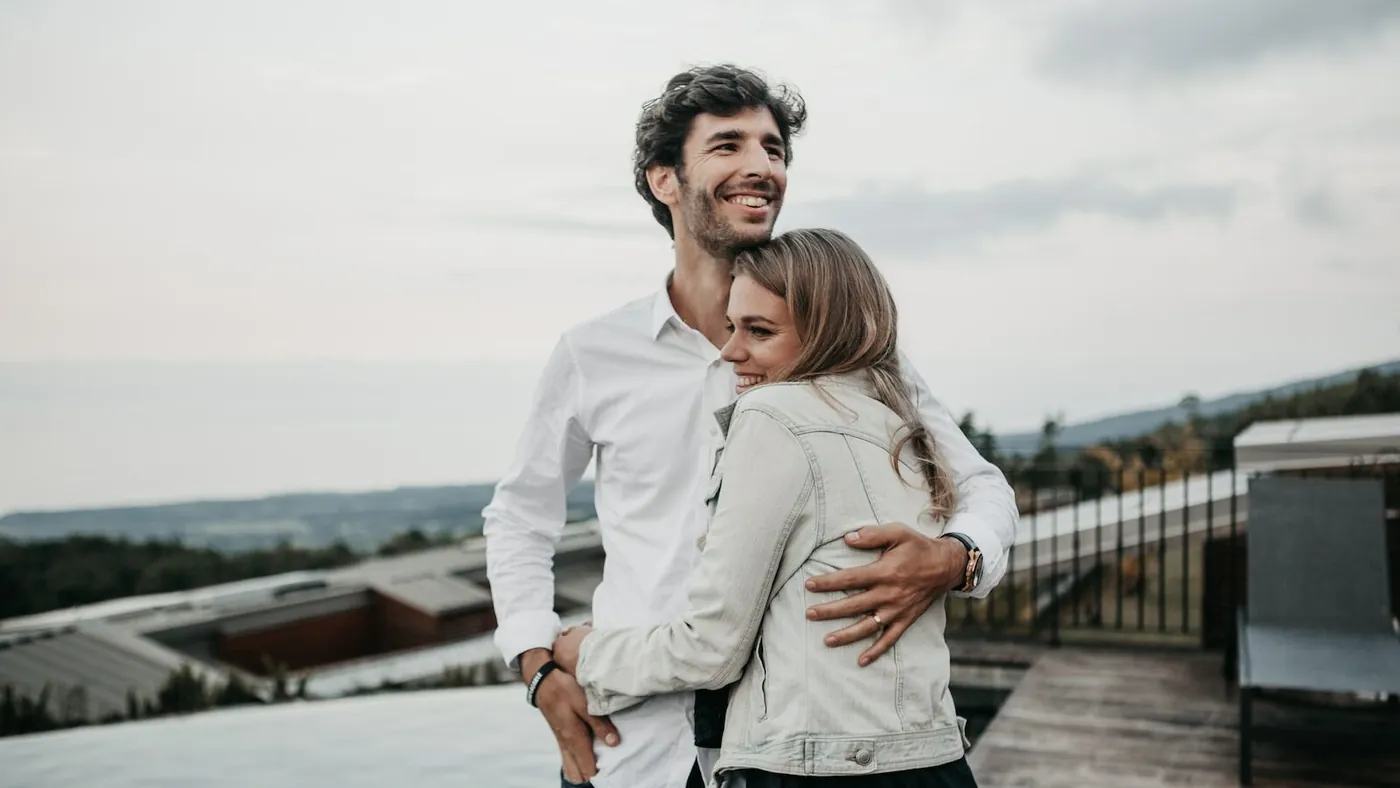 man and woman hugging each other